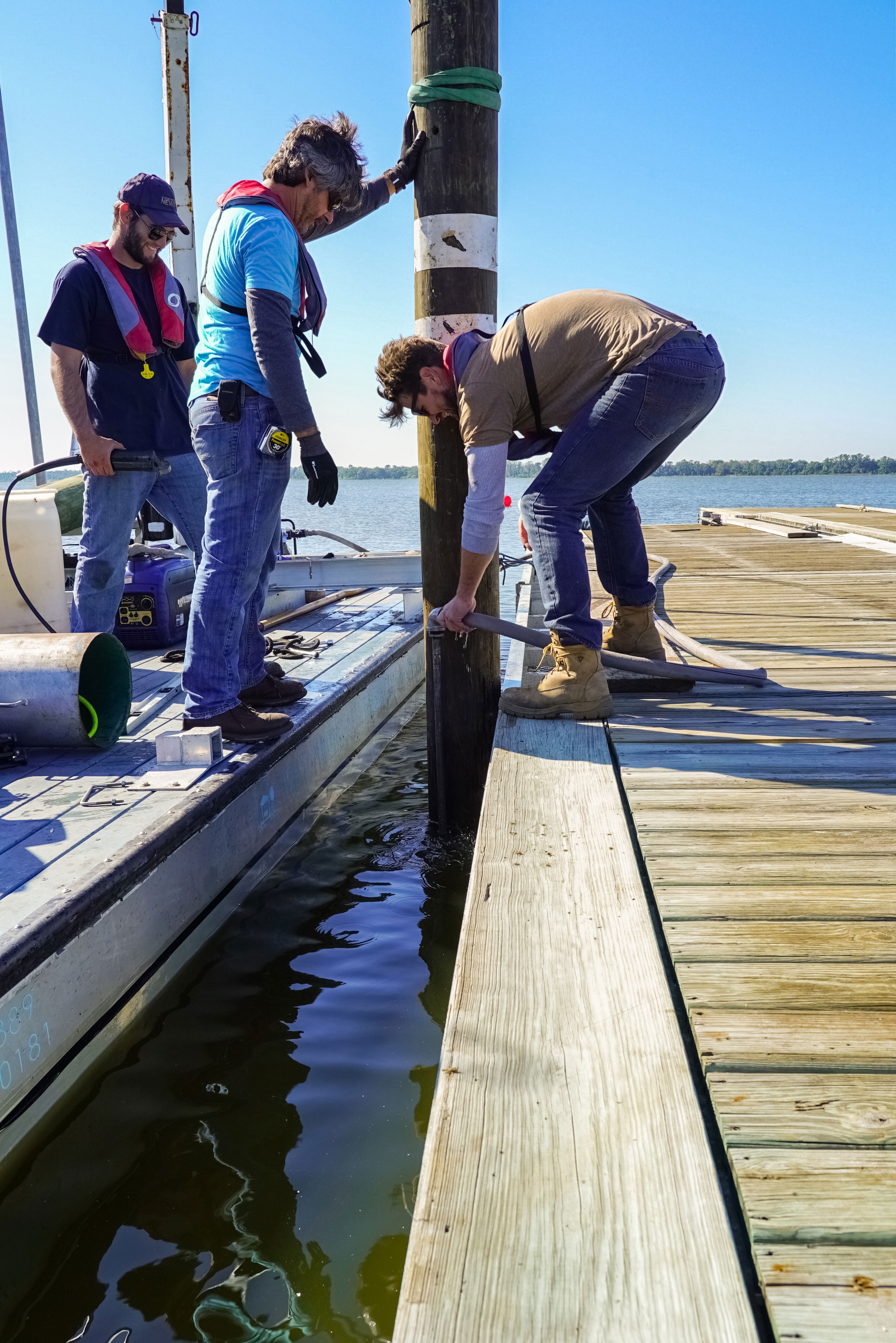 Floating Dock Rentals - Installing Piling - Allsports Productions